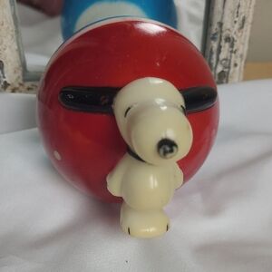 Red and White Vintage Peanuts Roly Poly Snoopy Plastic Chime Toy